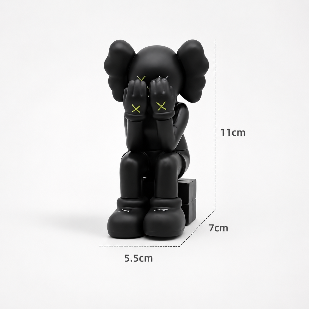 Sitting Kaws figurine