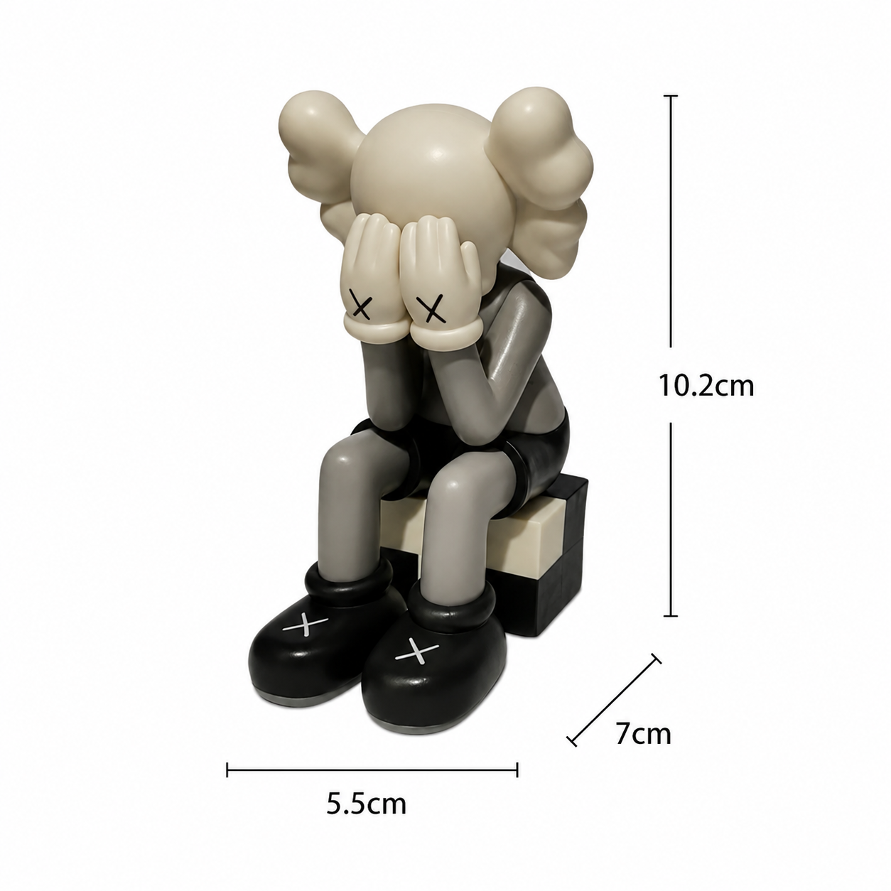 Sitting Kaws figurine