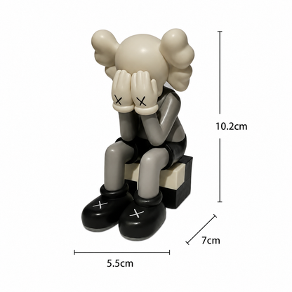 Sitting Kaws figurine