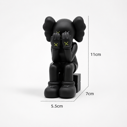 Sitting Kaws figurine